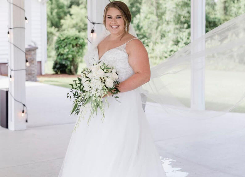 Model wearing a white gown