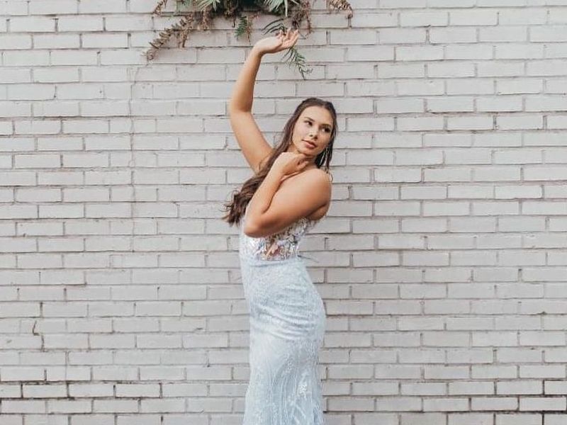 Model wearing a white gown